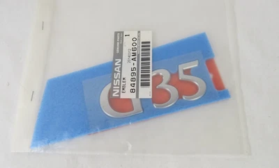 2003-2008 Infiniti G35 Emblem Rear Bumper Chrome Badge Symbol Logo Genuine OEM - image 1 of 3