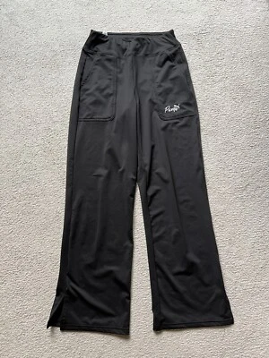 Pantalones de tiro medio que absorben la humedad Puma para mujer pantalones de chándal yoga elásticos negros Foto 1 de 4