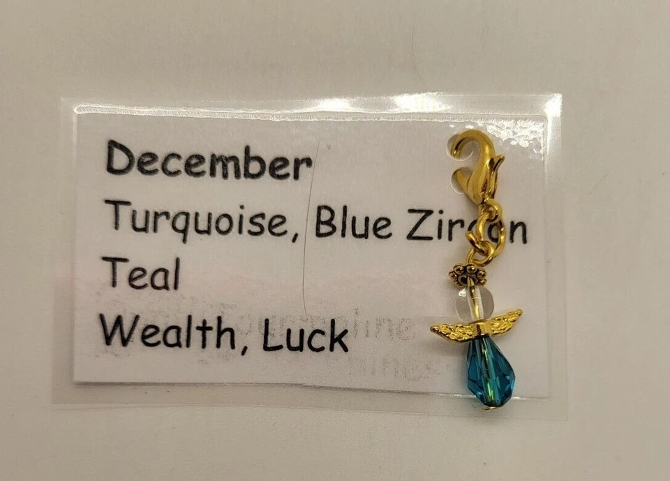 Berloque/puxador com zíper pedra de nascimento dezembro anjo da guarda; zircão azul; GP SP - Imagem 1 de 1