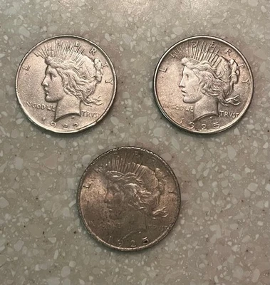 3 -  PEACE SILVER DOLLARS 90% SILVER US Dollar Silver Coins 1-1922, 2-1925 - Image 1 of 4
