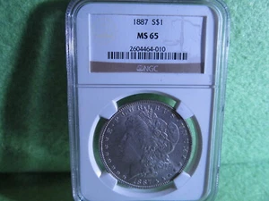 IMPRESSIVE 1887 MORGAN SILVER DOLLAR MS 65 BY NGC - Picture 1 of 3