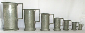 Antique Seven Piece Set of Laboratorio Quimico Municipal Pewter Measuring Cups - Picture 1 of 9