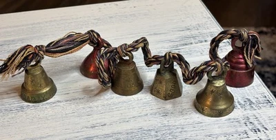VTG Christmas Brass Bells Colored/Etched India Set Of 6 On Twisted Rope  - Image 1 of 4