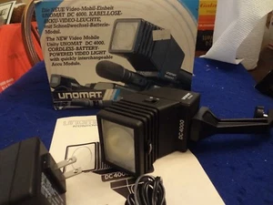 NOS UNOMAT DC4000 CORDLESS BATTERY POWERED VIDEO LIGHT NEW IN ORIGINAL PACKAGING - Picture 1 of 8