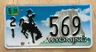 WYOMING LOW NUMBER AUTO  LICENSE PLATE " 21 569 " WY BUCKING BRONCO WESTON CO