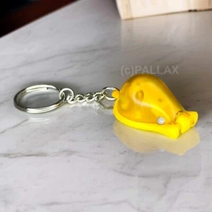 TUPPERWARE SCHLÜSSELANHÄNGER MESSER-MAUS ORANGE - Bild 1 von 2