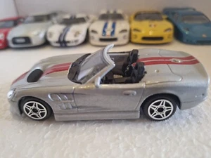Modellauto Bburago Shelby Series One 1 silbermetallic 1:43 Modellauto Sportwagen - Bild 1 von 9