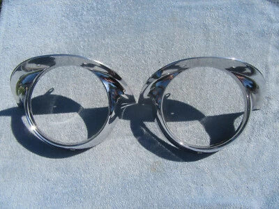 1957 CADILLAC COUPE DEVILLE HEADLIGHT HEADLAMP LENS BEZELS - Image 1 of 4