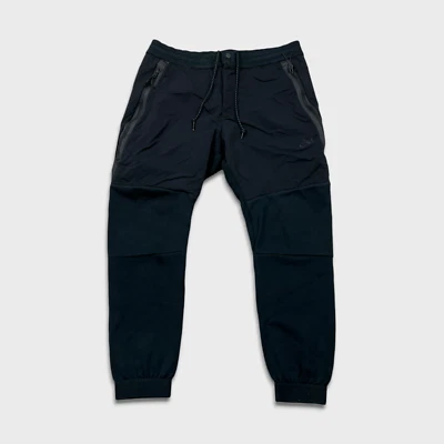 Pantalones deportivos Nike para hombre grandes negros tecnológicos polar Swoosh atléticos Foto 1 de 4