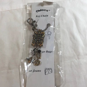 damen schlüsselanhänger mit messingfarbenen baumeln - Bild 1 von 7