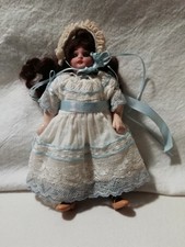 Small ANTIQUE DOLL with lace dress and blue ribbons