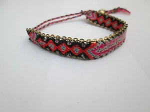 MULTI COLOURED CORD BRACELET AND SKULL PENDANT - Picture 1 of 3