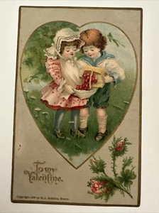 Cartolina San Valentino ragazzo e ragazza in giardino incorniciata nel cuore Robbins 1907 - Foto 1 di 2