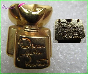 Pin's Flacon de Parfum dorée avec une fleur OSCAR DE LA RENTA #1995 - Bild 1 von 1
