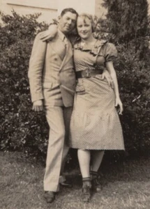 1940s Man Military Uniform Smiling Woman Lush Greenery Joyful Moment Portrait - Picture 1 of 3