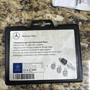 Genuine Mercedes Benz Silver Rim Wheel Locks CL GL GLK ML R S OEM B66470155 - Picture 1 of 4