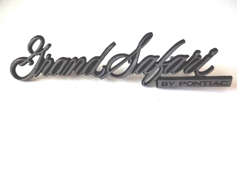 NOS 1970's PONTAC GRAND SAFARI FRONT HEADER HOOD BUMPER REAR TAILGATE EMBLEM - Image 1 of 4