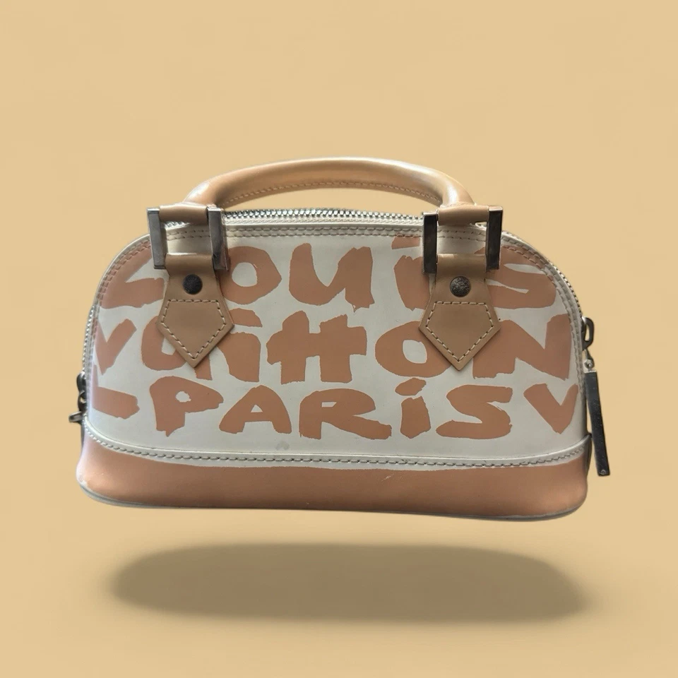 Bolso Louis Vuitton Alma con asa superior PM beige cuero blanco Foto 1 de 4