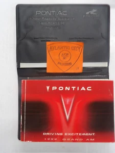 1999 PONTIAC GRAND AM OWNERS MANUAL W/CASE - Picture 1 of 3