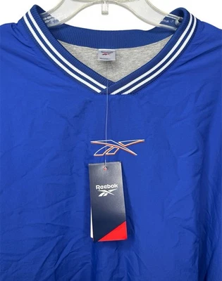 NUEVO CON ETIQUETAS Reebok Para Hombres XL Azul Cuello en V Manga Larga Pullover Suéter Uniforme Forrado Tejido Foto 1 de 4