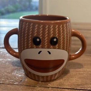 Taza de café de cerámica Sock Monkey marrón con doble mango de Galerie Candy - Imagen 1 de 6