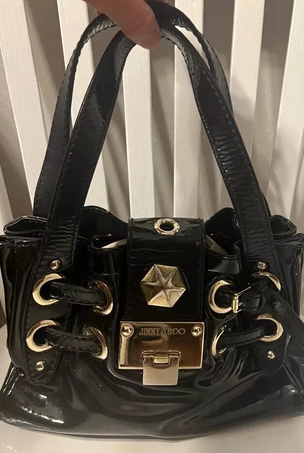 Cartera sin asas JIMMY CHOO negra suave lujosa charol con detalles dorados Foto 1 de 4