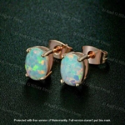 Bonitos aretes solitarios de ópalo de fuego de corte ovalado de 2 quilates con acabado en oro rosa de 14 quilates Foto 1 de 3