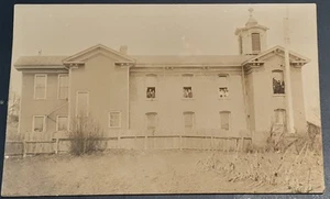RPPC NY People leaning out windows and standing on window ledge of building - Picture 1 of 2