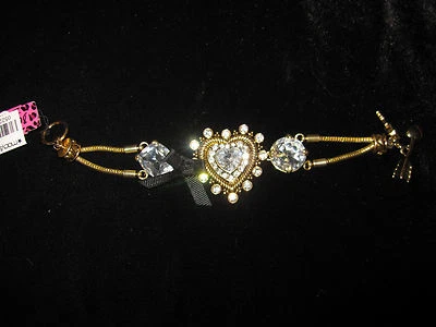 BETSEY JOHNSON ICONIC HEART OF GOLD HEART BLING AND BLACK BOW BRACELET - Image 1 of 3