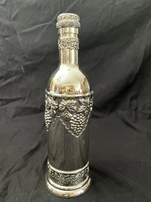 CADDY/SOPORTE BOTELLA VINO DISEÑO UVAS Y HOJAS DE UVA PELTRE. Foto 1 de 4