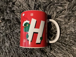 Neu mit Etikett The Grinch "H" Weihnachtstasse - H9,5 cm - rot - Bild 1 von 4