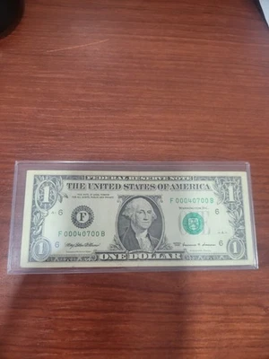 1999 ONE DOLLAR BILL WITH FANCY SERIAL NUMBER F00040700B - Image 1 of 4