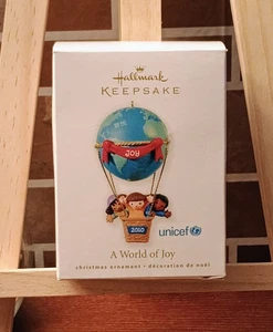 The Hallmark Ornament A World of Joy 2010 UNICEF Niños en globo aerostático - Imagen 1 de 2