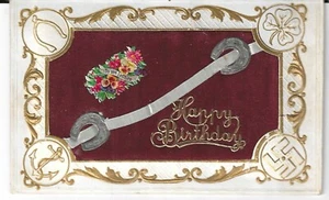 Happy Birthday 1910 postcard with red felt center surrounded by good luck items - Bild 1 von 2