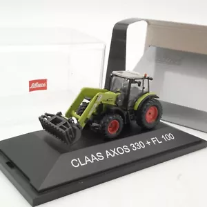 Schuco 1:87 25597 Claas Axos 330 + FL 100 in OVP QR9508 - Bild 1 von 3