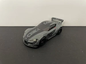 HOT WHEELS '20 TOYOTA GR SUPRA REAL RIDERS GRIS Y NEGRO DE TEAM TRANSPORT - Imagen 1 de 7