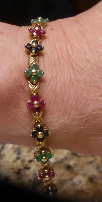 14K Yellow Gold Tennis bracelet with Rubies, Saphires & Emerld Flowers - Image 1 of 4