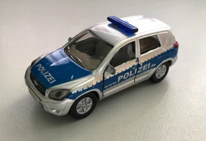 Siku 1431 - Toyota RAV 4 Polizei Streifenwagen - silber/blau- gebr. - Bild 1 von 4