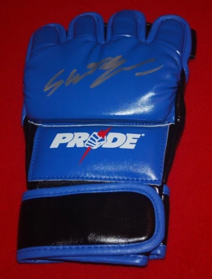 MAURICIO RUA SHOGUN PRIDE MMA Signed Glove Beckett Witnessed COA W796960 - Image 1 of 4