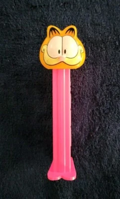 PEZ: GARFIELD w/Big Smile ~ Bright Pink Stem w/Feet ~ Patent 4.9 ~ Slovenia  - Image 1 of 4