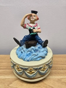 Caja de música vintage marinero payaso en barco perdido en el mar gira alrededor de cuerda funciona - Imagen 1 de 7