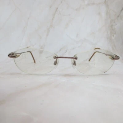 Revlon Warm Bronze Eyeglasses Frame RV512 Rose Gold Rimless Oval 49-16-135 - Image 1 of 4