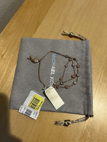 bracciale michael kors tono oro rosa 115€