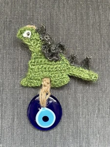 Rugir al estilo con ganchillo yute dinosaurio colgante de pared y mal de ojo turco - Imagen 1 de 9