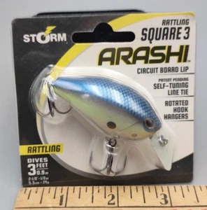 NEU Storm Arashi Rattling Square 3 Shad Blue Silber 1/2 oz 2-1/8" - Bild 1 von 2