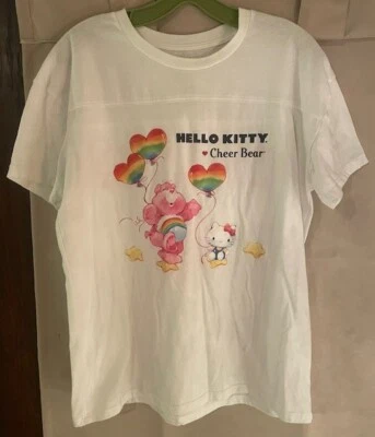 Womans Size L 11/13 Hello Kitty and Friends X Care Bears Cheer Bear T- Shirt - Image 1 of 3