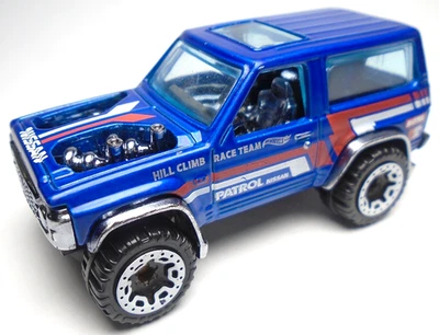 Camión SUV 2022 Hot Wheels Nissan Patrol Custom Hill Climb azul fundido a presión 2 5/8" Foto 1 de 4