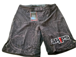 NWT-GRIPS FIGHT GREEN BATTLE WARRIORS INSTINCT MENS SHORTS, LYCRA, SIZE US M/33 - Picture 1 of 12