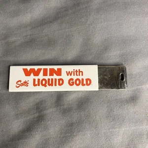 Vintage NOS Win mit Flüssiggold Box Cutter Werbung - Bild 1 von 7