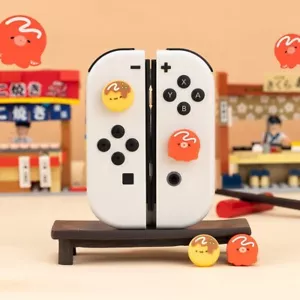 Tapas de agarre para pulgar GeekShare para Nintendo Switch/Switch OLED/Lite 4 piezas bola de pulpo - Imagen 1 de 6